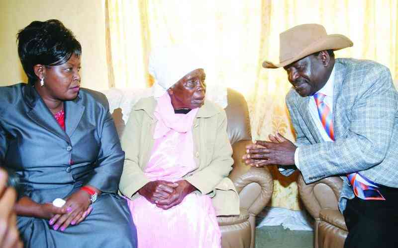 Mukami Kimathi speaking with Raila Odinga, with former Starehe MP Margaret Wanjiru on the left